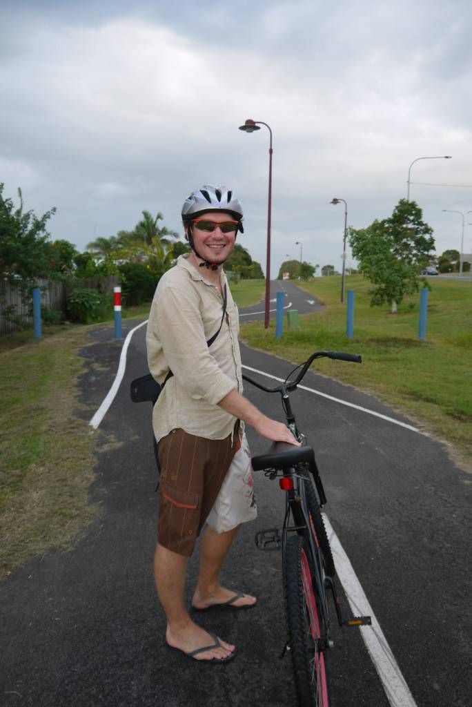 Andrew gets on his bike in Hervey Bay