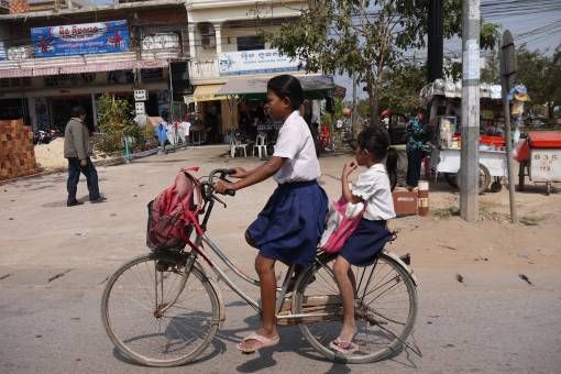 School Girls Riding a Bike in Cambodia