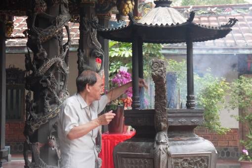 Lighting Incense at a temple in Taipei