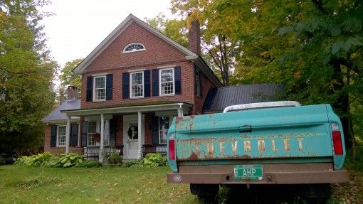 A beat-up Chevy in a Vermont driveway