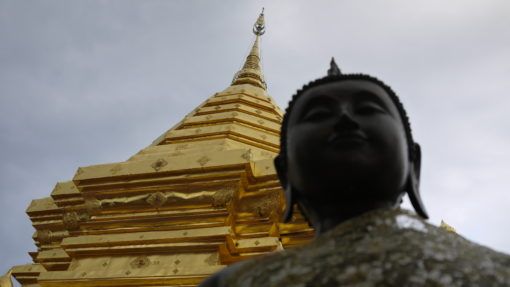 Close up of Buddha statue and pagoda at Wat Phra That Doi Suthep, Thailand 