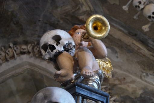 Skull and baby statue in Kutna Hora Bone Church, Czech Republic 