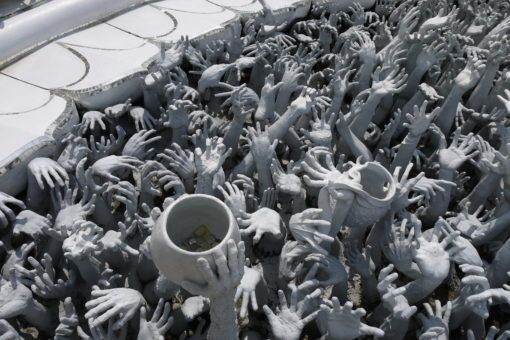 Hands reaching from hell at the White Temple, Thailand