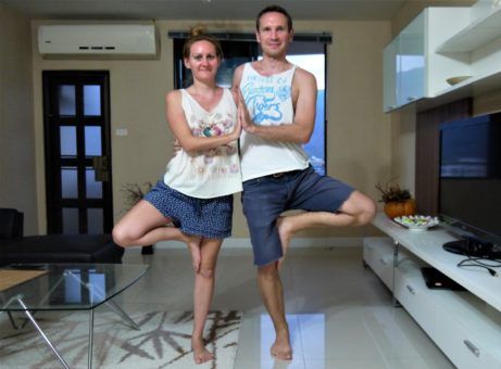 Us practising yoga - the couples tree pose