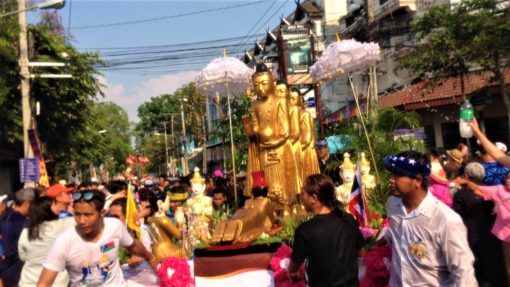 Float carrying Buddha statues in Songkran Parade Chiang Mai