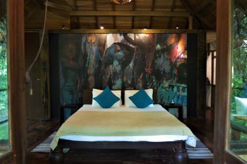 The wonderful bedroom at Diyabubula with Laki's artwork