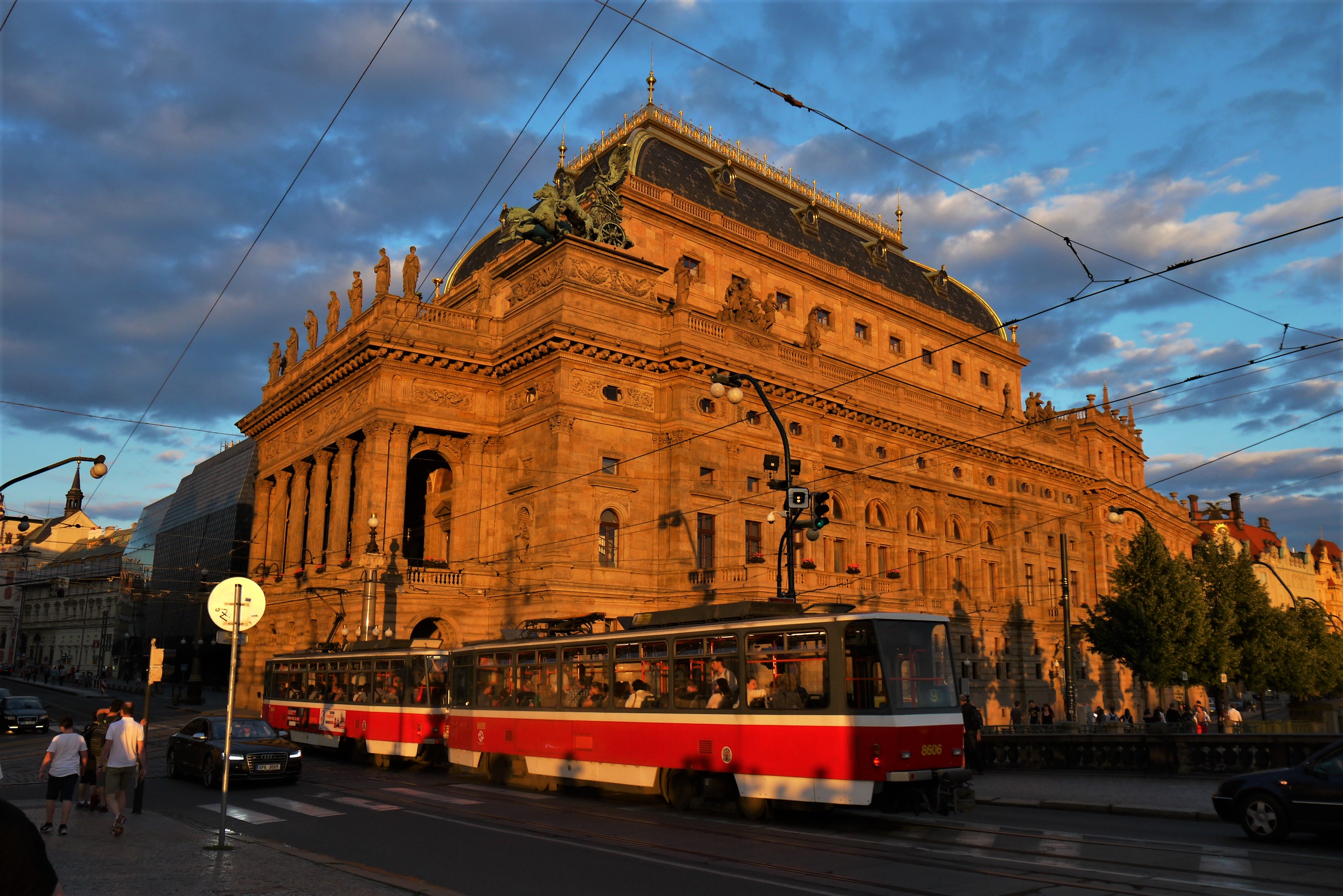 A tram passes the National Theatre in Prague