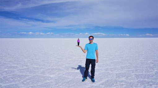 Bolivian Salt Flats Tour perspective shot - large person holding small person on their palm