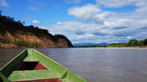 travelling by boat in the Amazon Rainforest