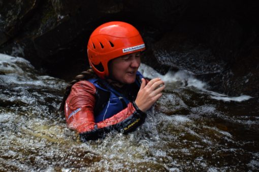 Me in the water after jumping off a cliff on the River Findhorn in Scotland