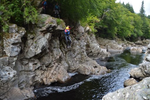Andrew jumping off an 8-metre cliff into the river in Scotland