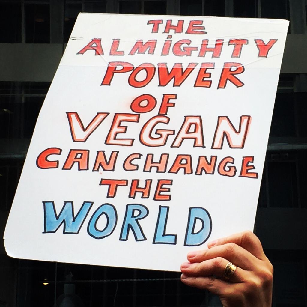 The almighty power of vegan can change the world placard at Animal Rebellion Protest, London