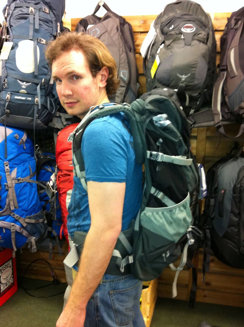 Andrew trying on backpacks for our round the world trip
