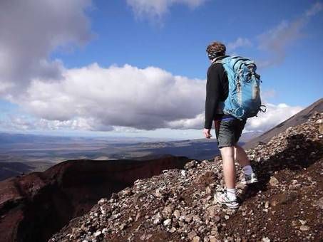 Andrew on a Mountain with a Backpack on - minimalism and travel 