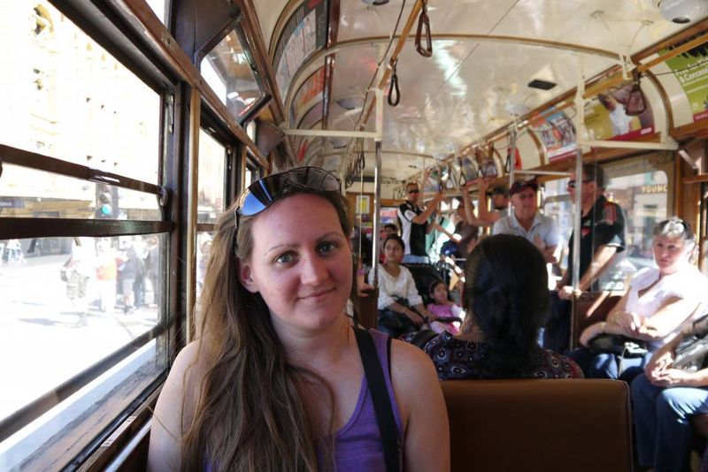 Amy riding the Tram in Melbourne