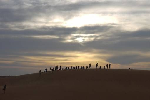 Watching sunset on the Red Sand Dunes