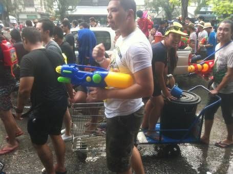 Thai People with Water Guns Celebrating Songkran