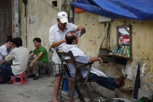 Street barber in Hanoi