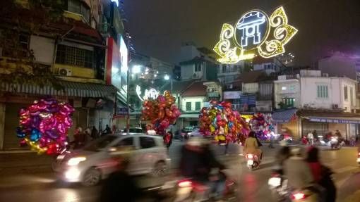 Life in Hanoi: Balloons on a Hanoi Street at Night