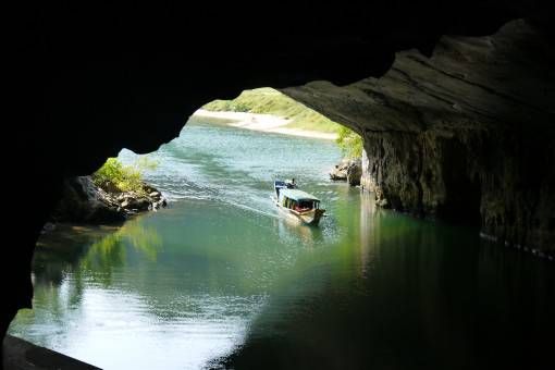 A tourist boat entering Phong Nha Cave