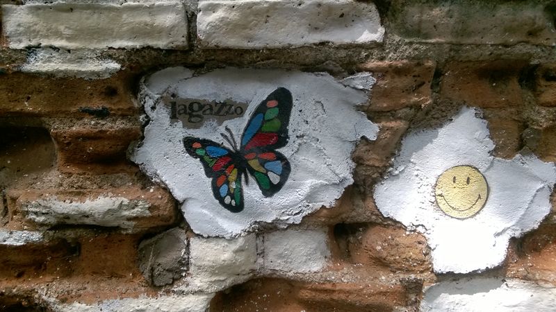 Butterfly and smiley face street art in Chiang Mai