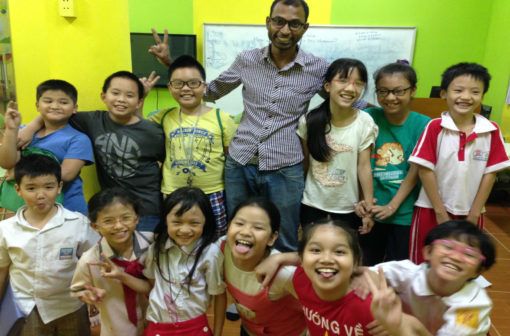 Non native English teacher Venkat with his students in Vietnam 