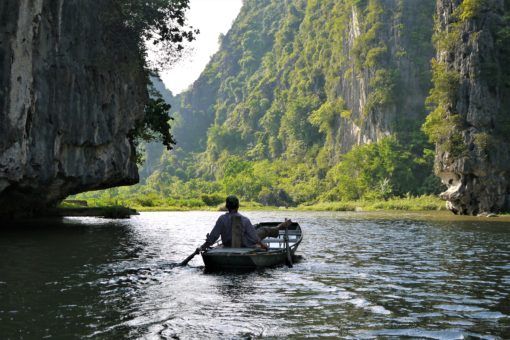 Boatman on the river in Tam Coc, Vietnam