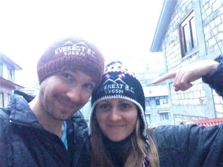 Us wearing Everest Base Camp souvenir hats 