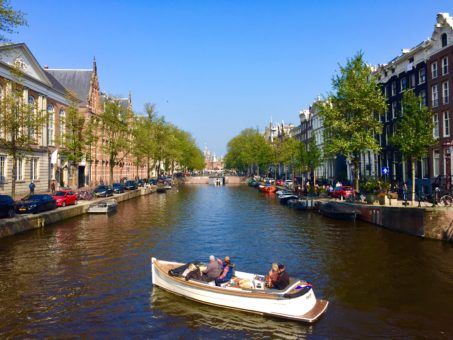 A boat on a canal in Amsterdam, The Netherlands