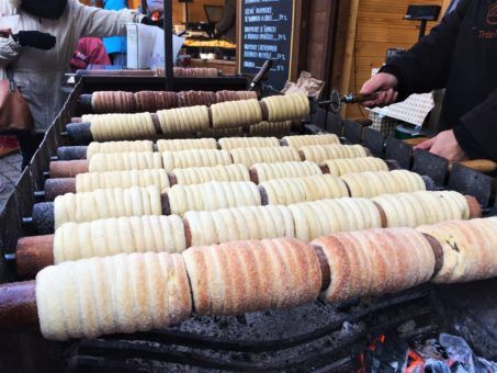 The Trdelnik or chimney cakes cooking at the Christmas Markets in Prague
