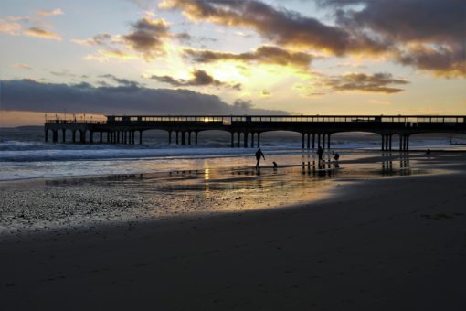Sunset over Boscombe pier and the sea in Bournemouth, UK