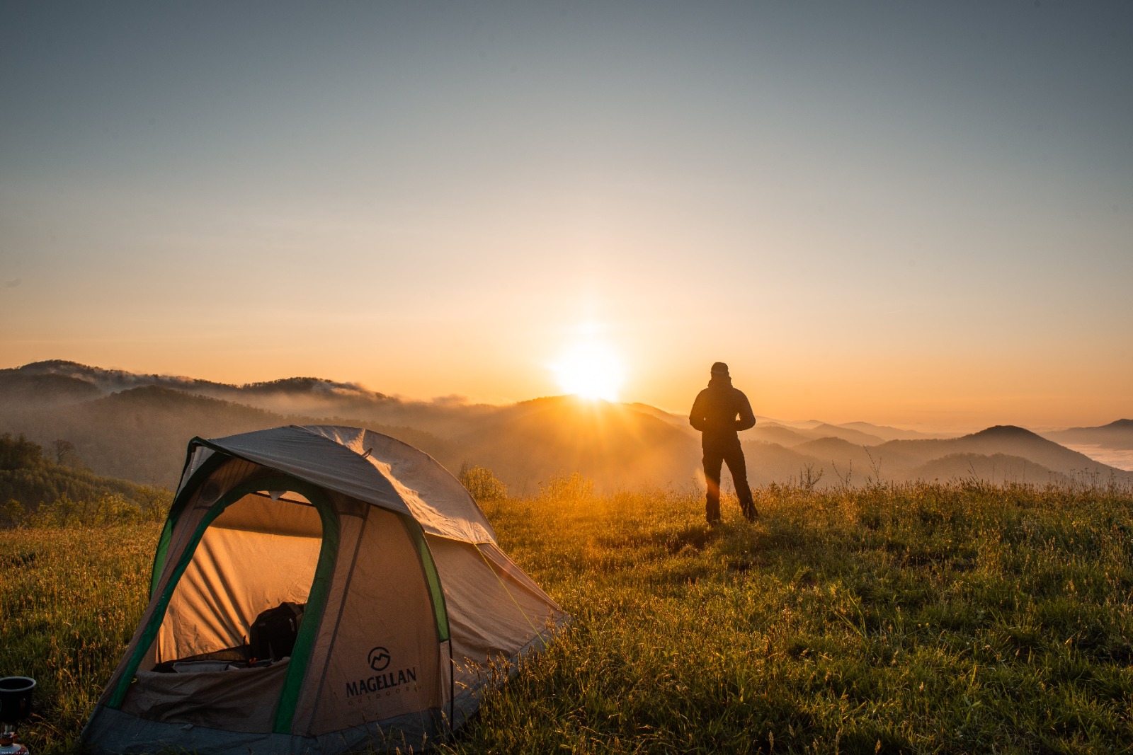 Wild camping in the mountains at sunrise 